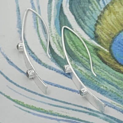 Silverörhängen, Zircon