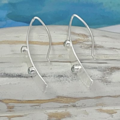 Silverörhängen, Zircon